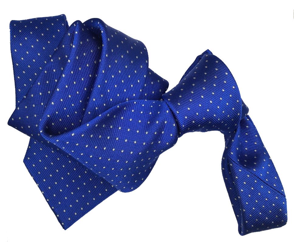 Corbata azul con dibujo de topos.